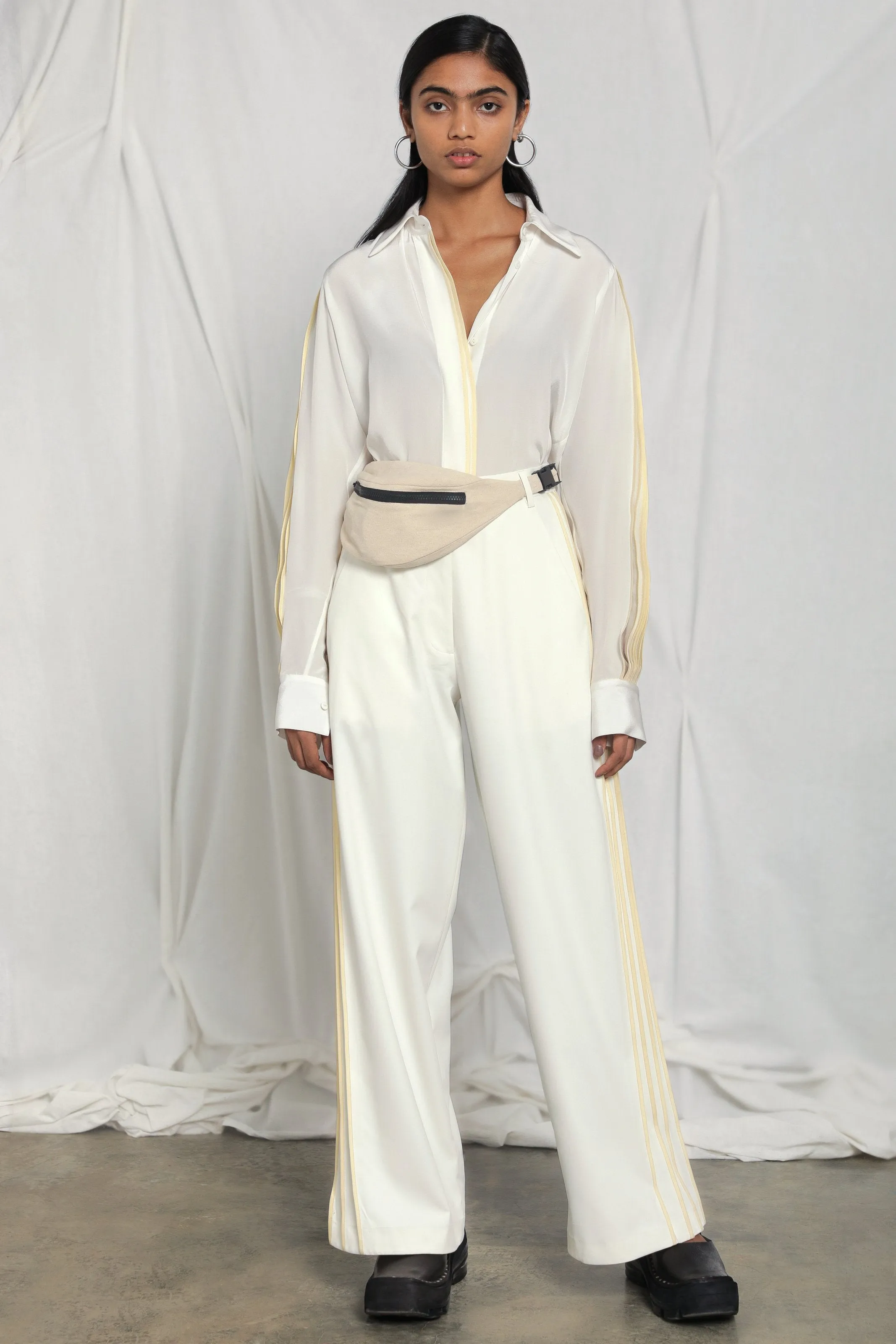 Wide-leg trousers with side pleats